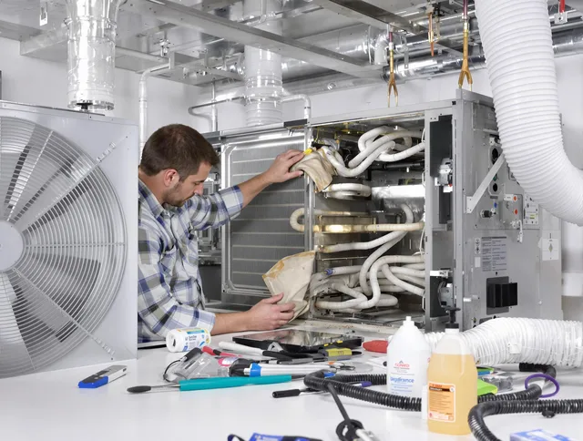 Tiverton Air Duct Cleaning specialist performing precision AC coil cleaning in Tiverton