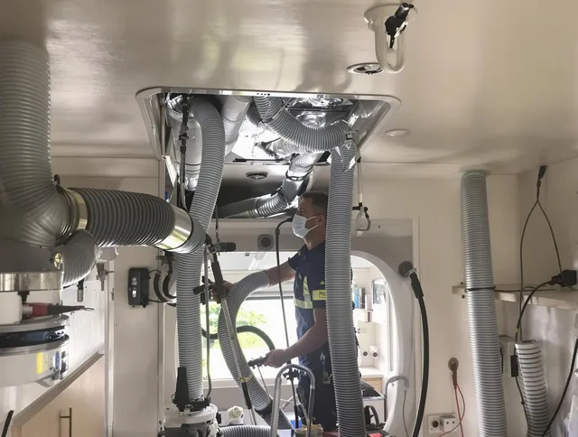 Tiverton Air Duct Cleaning specialist performing precise mobile home duct cleaning in Tiverton