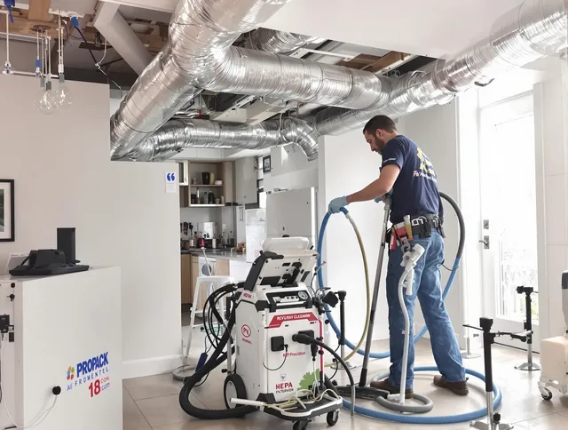Tiverton Air Duct Cleaning technician performing advanced pure duct cleaning with specialized equipment in Tiverton