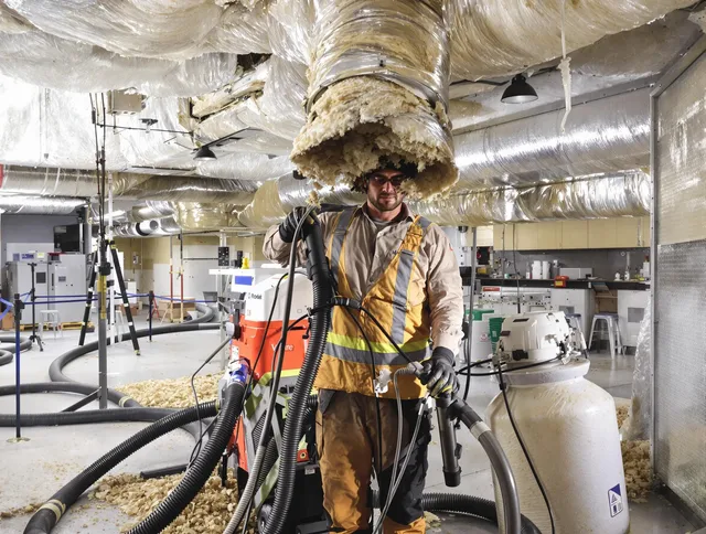 Professional vacuum insulation removal by Tiverton Air Duct Cleaning expert in Tiverton